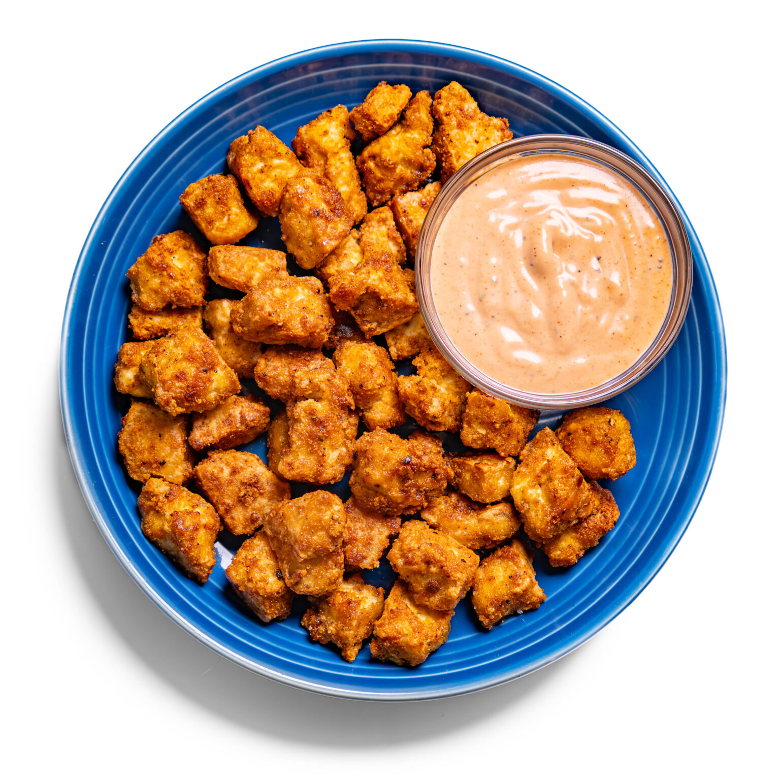 Crispy air fryer tofu bites golden cubes with soy sesame glaze for vegetarian party appetizer option